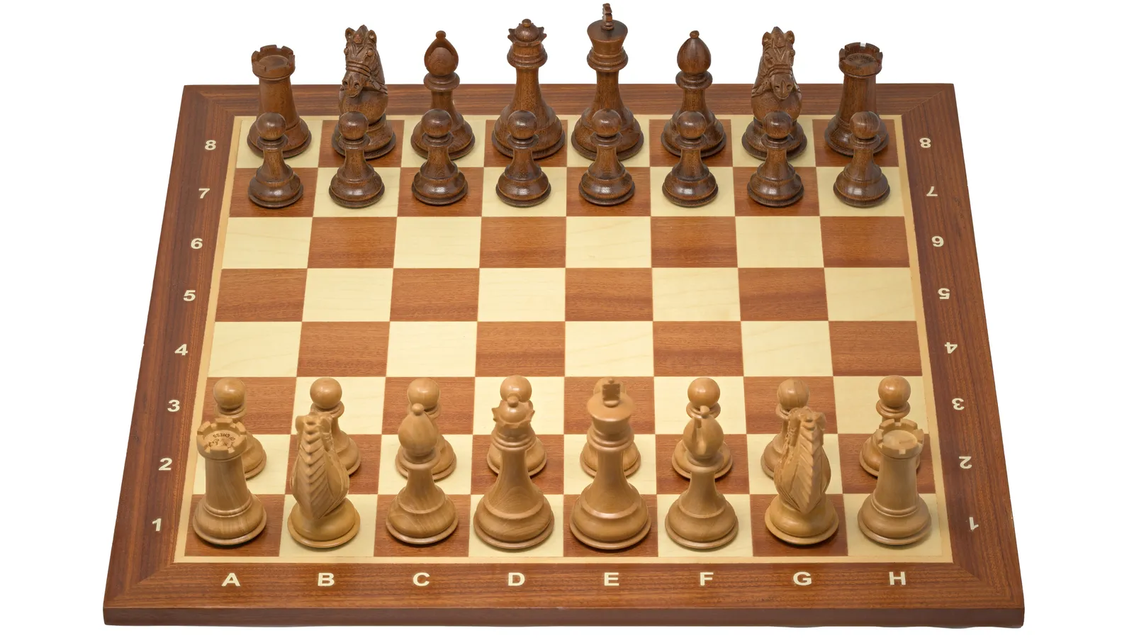 A chess board with wooden pieces in the middle of a game