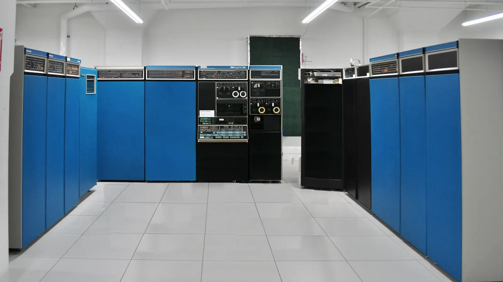 A row of blue mainframe computer cabinets in a computer museum